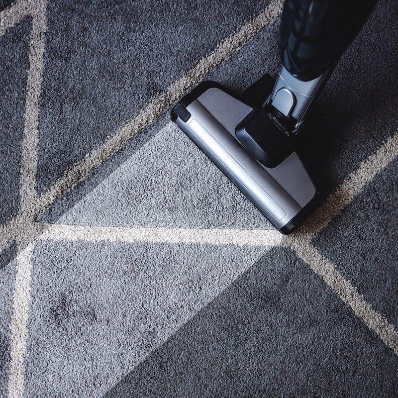 Close up of steam cleaner cleaning very dirty carpet.